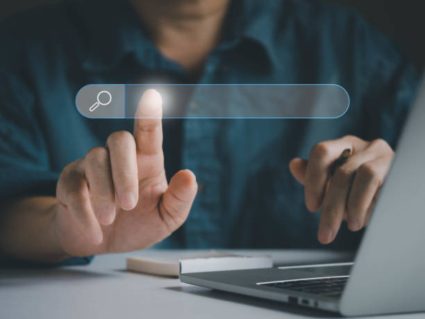 istock Businessman searching, finding information online internet via virtual browser box 1443005630