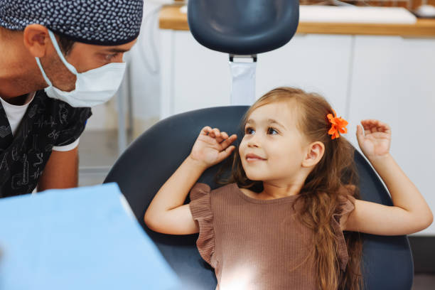 istock Young child girl check out teeth at dentist office 1443006063