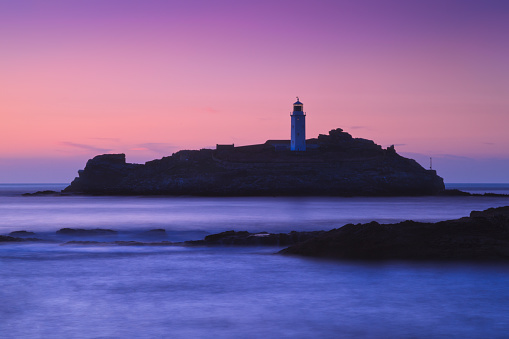 Godrevy Lighthouse was built in 1858–1859 on Godrevy Island in St Ives Bay, Cornwall. Standing approximately 300 metres off Godrevy Head, it marks the Stones reef, which has been a hazard to shipping for centuries.