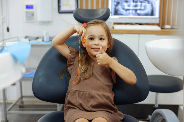 istock Young child girl check out teeth at dentist office 1443006692