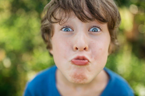 istock face portrait funny boy grimace 1443010822
