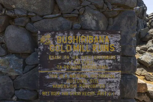 Photo of Close up view of Bushiribana gold mill ruins memorial desk. Aruba.