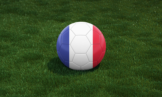 Soccer ball with France flag colors at a stadium on green grasses background. 3D illustration.