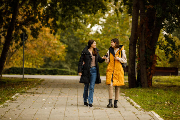 istock Two young women taking a relaxing walk through the park, chatting casually and bonding 1443019946