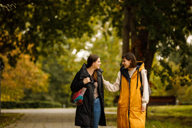 istock Two young women taking a relaxing walk through the park, chatting casually and bonding 1443019985