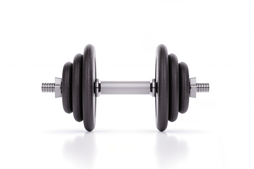 Iron dumbbell on white background. Horizontal composition with copy space.