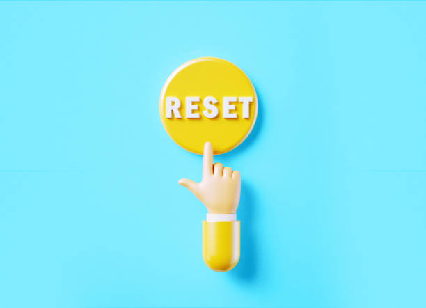 istock Cartoon Style Human Hand Clicking Over A Yellow Push Button: Reset Is Written On Push Button 1443020901