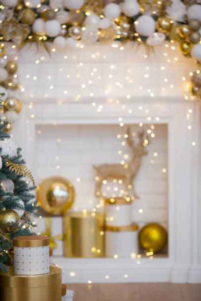 istock Beautiful New Year gift boxes with satin ribbon bow under Christmas tree. 1443023090