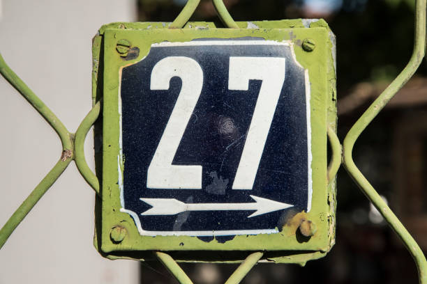 istock Weathered enameled plate number 27 1443023360