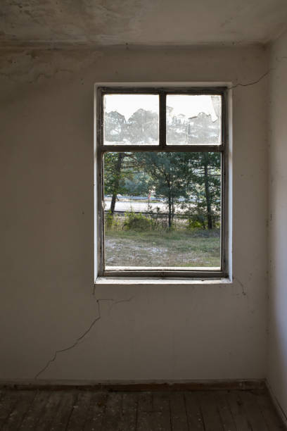 istock Old and abandoned home interior room with window frame 1443024485