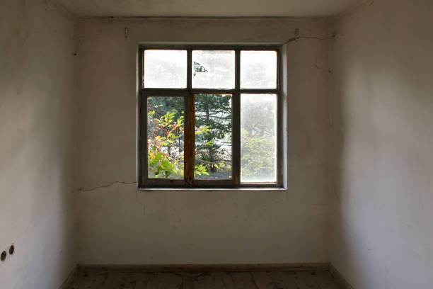 istock Old and abandoned home interior room with window frame 1443024515