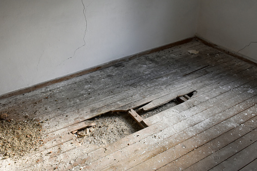Damaged and ruined wooden flooring in the home