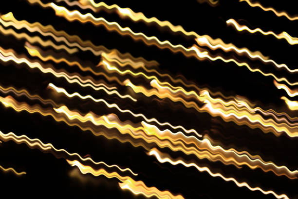Yellow glowing swirl wave, fire light effect, line, lightning electric discharge. Twisted yellow glowing wavy curves. Technology, data flow on black isolated background