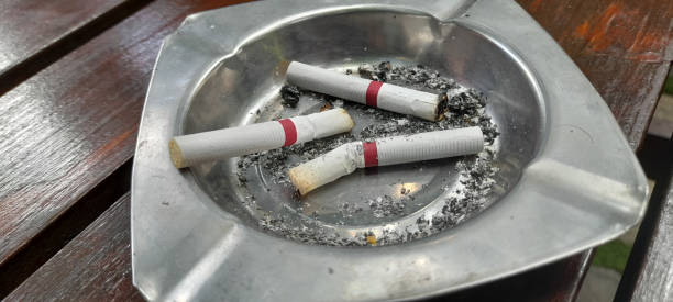 istock cigarette butts and ashes in a metal ashtray 1443027138