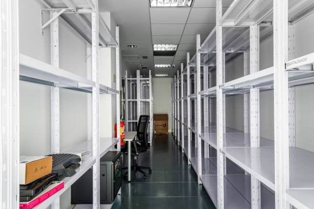 istock Empty storage room in coworking space with empty shelves 1443028647