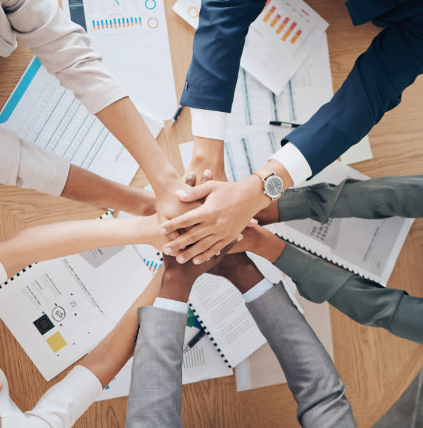 istock Office hands work on paperwork together, showing corporate cooperation and healthy community culture to reach business goals. Success is collaboration through teamwork, innovation and positivity 1443030934