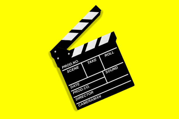 istock Clapperboard for shooting video footage takes on a yellow background 1443030984