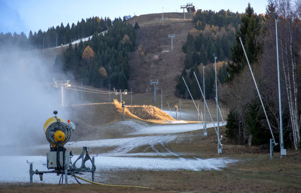 Artificial snow on the ski slopes snow cannon for snowmaking artificial snow stock pictures, royalty-free photos & images