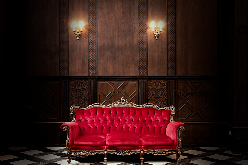 fashionable luxury classic throne red sofa velvet decorate with gold in the dark room