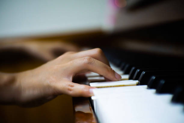 istock Close up playing piano in the room. 1443037075