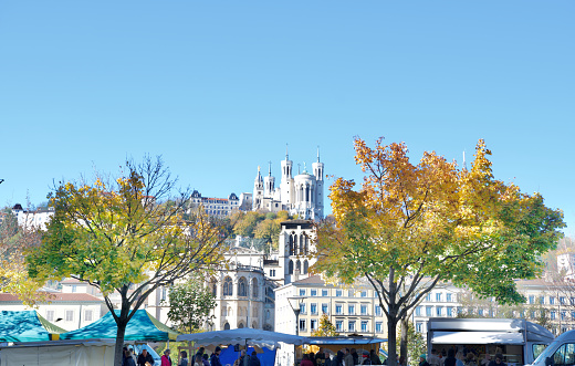 Autumn Panorama of Lyon with in the foreground the market saint Antoine, and in the background the magnificent basilica our lady of Fourvière.