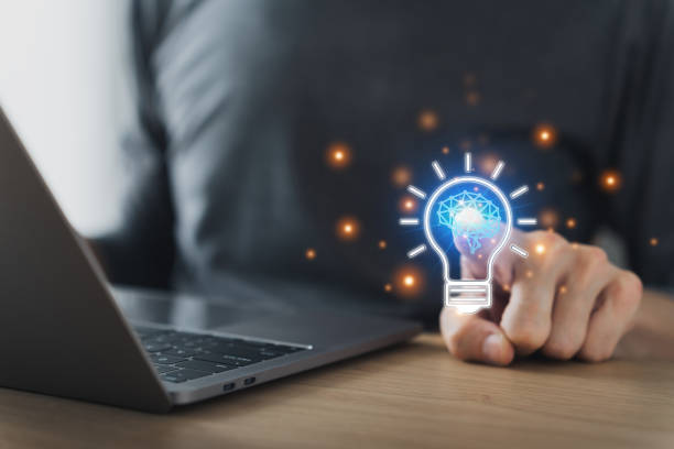 istock Businessman working or student studying and holding bright lightbulb. Business or education success or growth idea concept, creativity and strategy thinking, online knowledge and cognition learning 1443038938
