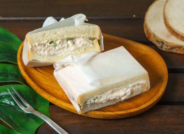 tuna cheese sandwich served in a wooden dish isolated on table top view of taiwan breakfast food - melting tuna cheese toast imagens e fotografias de stock