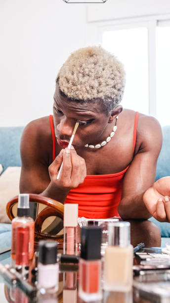 istock Black african person applying makeup at home. 1443041493