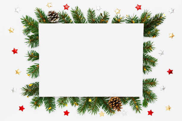 istock Christmas, New Year holiday layout with copy space for text. Blank white paper in frame of natural fir tree branches, pinecones and decorations on white flat lay background. 1443041733