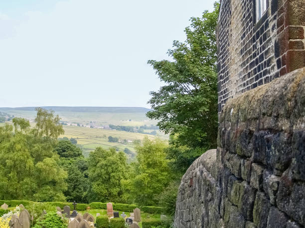 istock English landscape view over graveyard biside stone building 1443042336