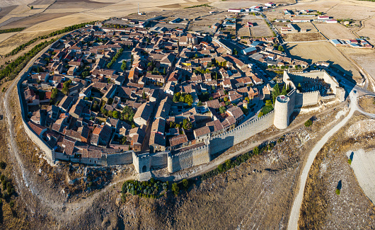 Aerial view of the Spanish medieval town of Urueña in Valladolid, with its famous walls in the foreground.
