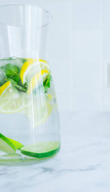 istock Decanter with a drink of lemon, lime and mint 1443043973