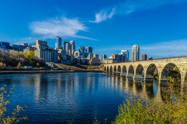 Downtown Minneapolis, Minnesota as seen from the famous stone arch bridge stock photo