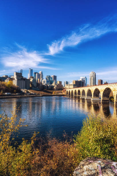 Downtown Minneapolis, Minnesota as seen from the famous stone arch bridge stock photo