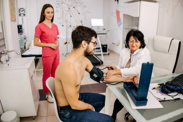 istock Doctor checking blood pressure to a patient 1443047203