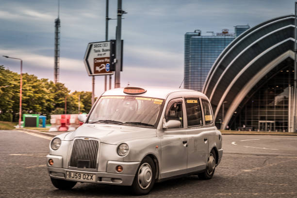 Glasgow, Scotland - July 11, 2022: The cab is leaving the Scottish Event Campus in the summer afternoon.