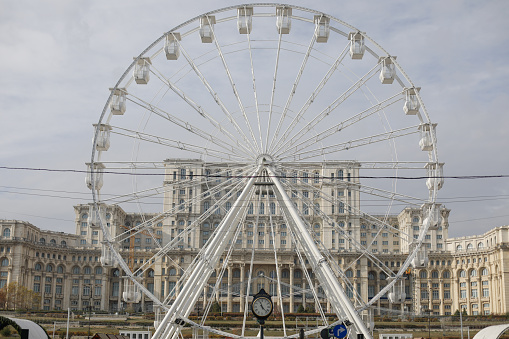 Large Ferris wheel at a amusement park against clear sky with copy space.