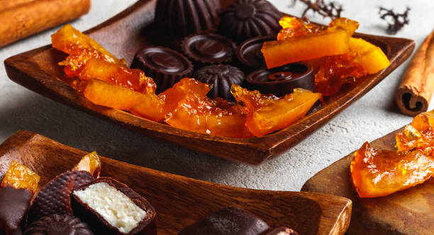 istock Candied orange slices in chocolate. Various chocolate candies 1443051930