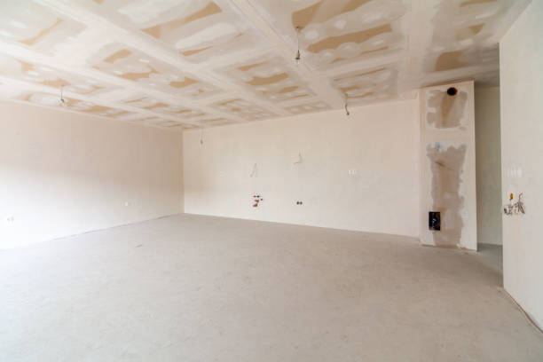 istock New empty room under construction. Plaster walls. New home. Concrete walls. Interior renovation. 1443053418