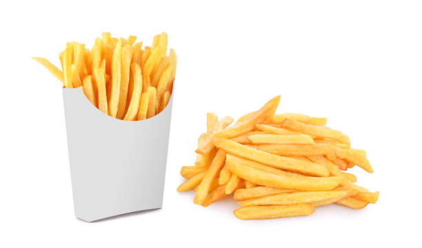 French fries in a white paper box isolated on white French fries in a white paper box isolated on white background. french fries stock pictures, royalty-free photos & images