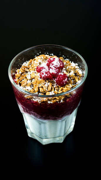 Smoothies. Fruit dissert with nuts and cherries in a glass cup. Milk and fruit smoothie with nuts and cherries. Smoothies. Fruit dissert with nuts and cherries in a glass cup. Milk and fruit smoothie with nuts and cherries. dissert stock pictures, royalty-free photos & images