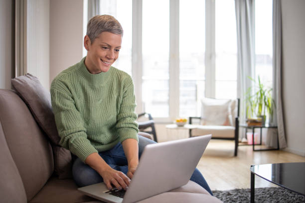 istock Mid adult woman working from home 1443058009