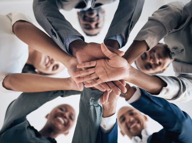 istock Motivation, partnership hands and business meeting with support, team building or teamwork in company workshop. Collaboration, community and diversity with vision, mission and networking form bottom. 1443058431