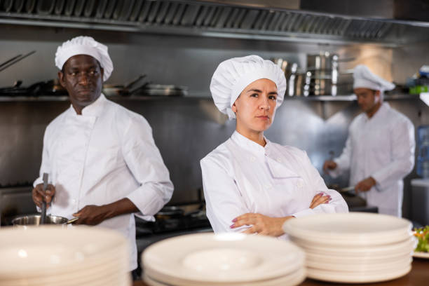 istock Woman head chef posing in restaurant kitchen 1443058864