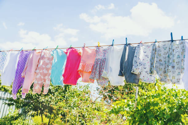 istock Baby clothes are drying on the street. Selective focus. 1443059678