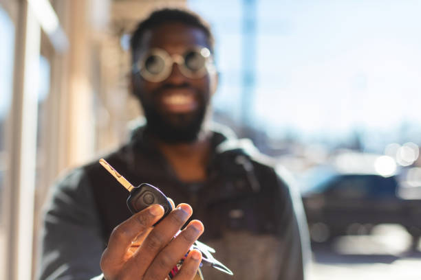 Hipster man holds the key.