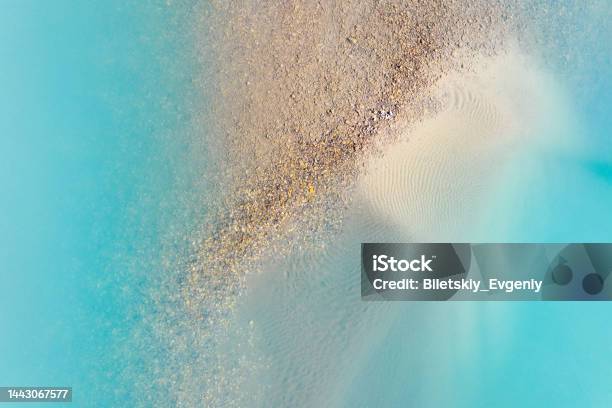 Clear Azure Water In A Mountain Lake The Shore With Stones View Of The Water From A Drone Landscape From The Air Natural Landscape As Wallpaper Mountain Lakes Of Alberta Canada Stock Photo - Download Image Now
