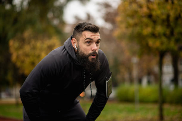 istock Young man catching his breath after a run 1443068883