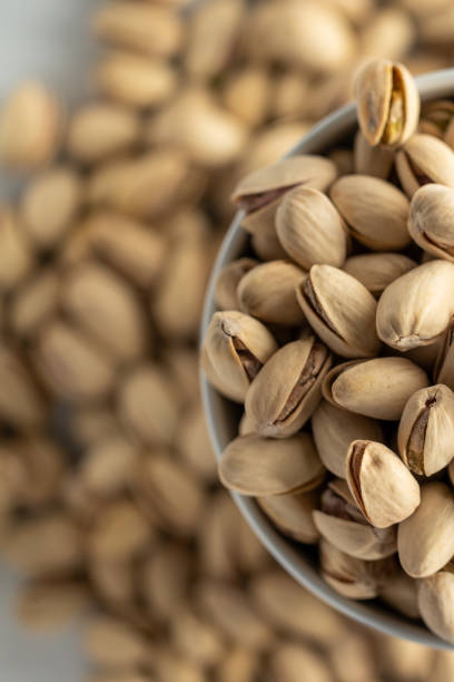istock Pistachio texture.  nuts.  Green fresh pistachios as a texture. 1443076701