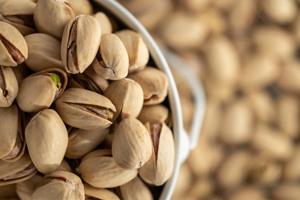 istock Pistachio texture.  nuts.  Green fresh pistachios as a texture. 1443080061